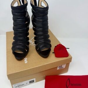 Christian Louboutin Black Heels with High Stiletto and Strappy Design